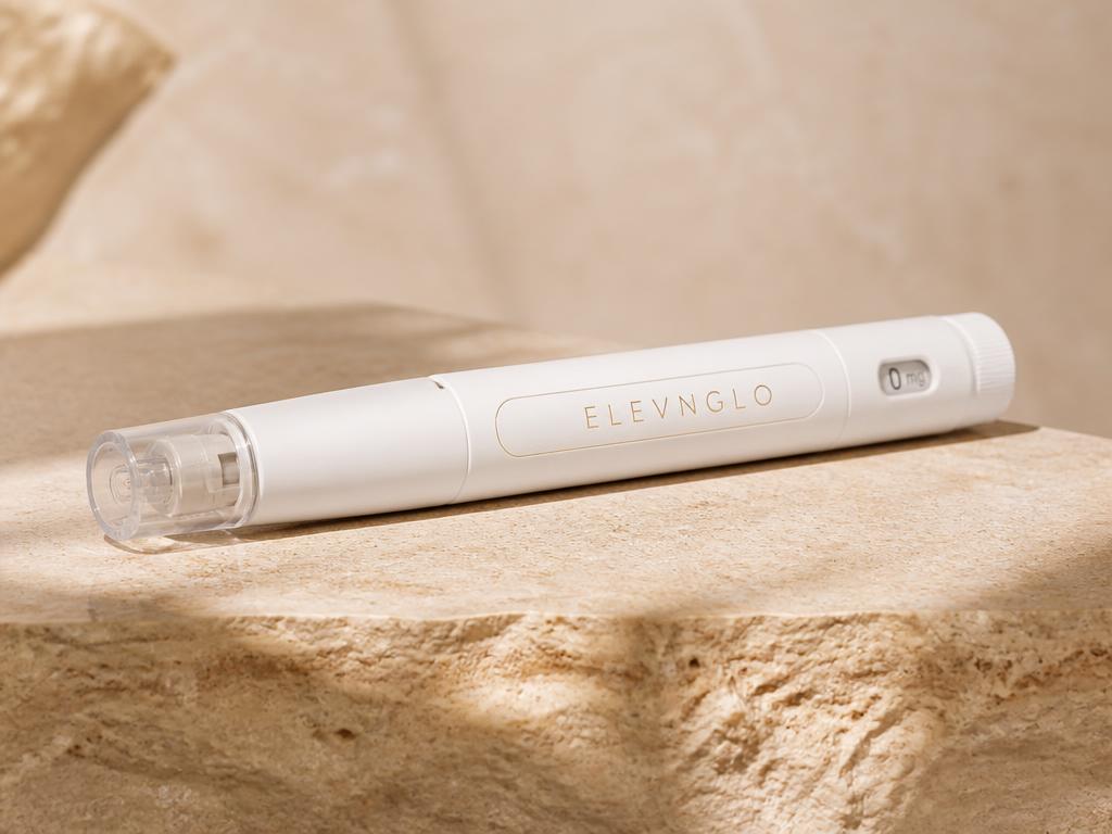 ELEVNGLO branded single-dose GLP-1 injection pen on a stone surface